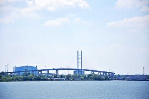 a bridge over a large body of water at Ferienwohnung Altefaehr mit Seebli in Altefähr +14 photos