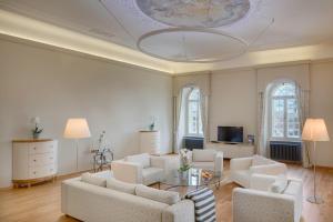 a living room with a couch and chairs and a table at Chateau Herálec Boutique Hotel & Spa by L'Occitane in Herálec