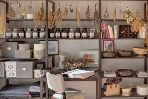a room with a desk and shelves with books at Chateau Herálec Boutique Hotel & Spa by L'Occitane in Herálec