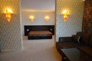 Ένα ή περισσότερα κρεβάτια σε δωμάτιο στο Chateau-Hotel Trendafiloff -B&B