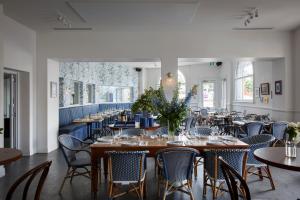 a dining room with tables and chairs and tablesearcher at The Provincial Boutique Hotel in Ballarat