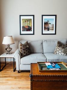 a living room with a couch and a coffee table at Hotel Normandie - Los Angeles in Los Angeles