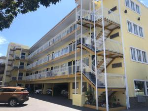 an apartment building with balconies and a parking lot at Presidio Parkway Inn in San Francisco