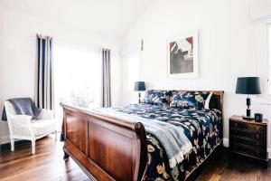 A bed or beds in a room at Nightcap Ridge - Byron Bay Hinterland