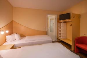 Katil atau katil-katil dalam bilik di Hotel Lüneburg Süd