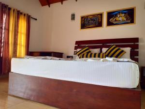 Letto o letti in una camera di Sigiriya Nature Resort