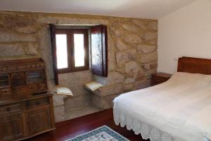 A bed or beds in a room at Casa Da Gaiteira