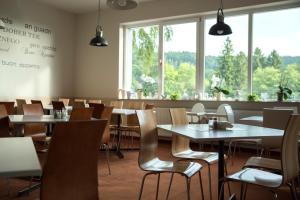 Reštaurácia alebo iné gastronomické zariadenie v ubytovaní 4family *RESORT*SPA*
