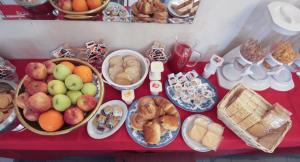 a table topped with lots of different types of food at Hotel Rose&Crown in Correggio +21 photos