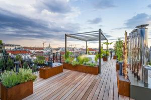 a rooftop deck with plants on a building at Luxury Residence near Parlament in @YourVienna in Vienna