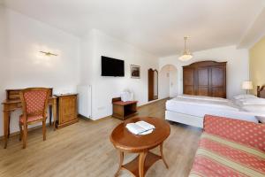 TV a/nebo společenská místnost v ubytování Hotel Mühle Mayer
