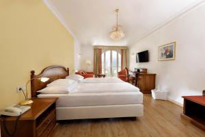 Postel nebo postele na pokoji v ubytování Hotel Mühle Mayer