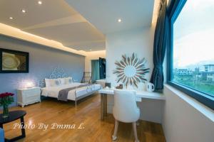 Postel nebo postele na pokoji v ubytování Han-Shian Boutique B&B