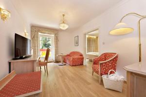 TV a/nebo společenská místnost v ubytování Hotel Mühle Mayer