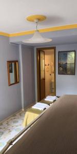 Postel nebo postele na pokoji v ubytování Villaggio "Camping Pompei" Bungalow