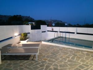 a swimming pool on the roof of a house at A Sea of Stars in Pefki Rhodes