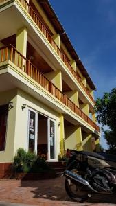 a motorcycle parked in front of a building at Free Beach Resort in Phú Quốc