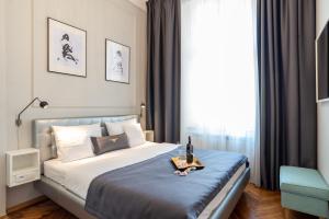 Łóżko lub łóżka w pokoju w obiekcie Bentis Luxury Apartments