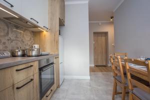 Kuchyňa alebo kuchynka v ubytovaní CR Apartament przy Rynku Sienkiewicza 6
