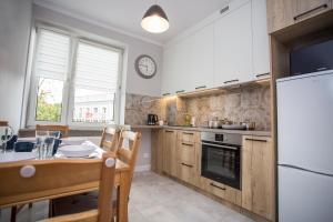 Kuchyňa alebo kuchynka v ubytovaní CR Apartament przy Rynku Sienkiewicza 6