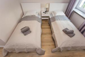 Posteľ alebo postele v izbe v ubytovaní CR Apartament przy Rynku Sienkiewicza 6