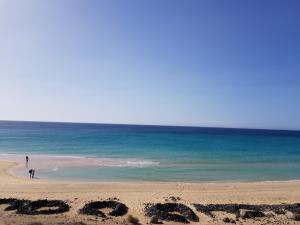 an empty beach with the word written in the sand at Loft del Mar 2 Jandia in Playa Jandia