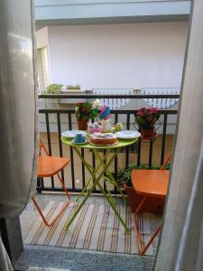 a table on a balcony with food on it at B&B Stupor Mundi in Altamura
