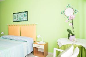 Postel nebo postele na pokoji v ubytování B&b Margherita + 17 fotografií