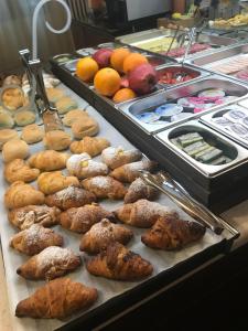 a buffet of pastries and other foods on a table at Locanda Art Deco in Venice