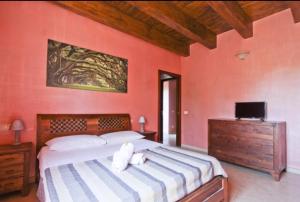 a bedroom with a large bed and a tv at Dal Centurione in Rome