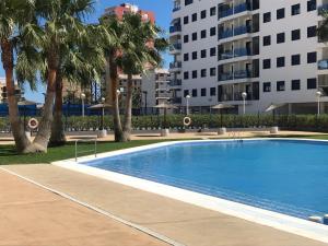 Poolen vid eller i närheten av Playa Valencia Residencial Sol y Mar Terraza con Vistas y Parking