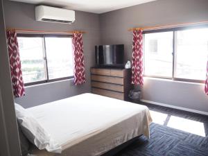 מיטה או מיטות בחדר ב-GUEST HOUSE BOSTONS