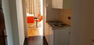 a small kitchen with a sink and a table at Hotel-Villa Lalee in Dresden +103 photos