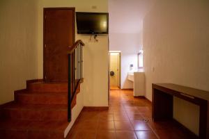 TV a/nebo společenská místnost v ubytování Hotel Degollado