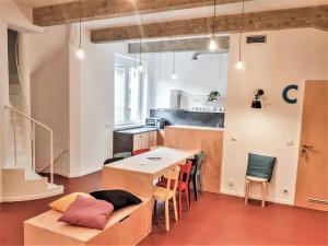 a kitchen and dining room with a table and chairs at CMYK Ústí nad Labem in Ústí nad Labem