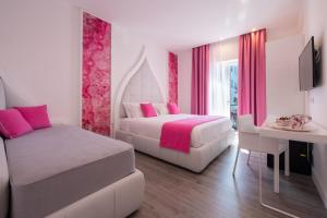 Postel nebo postele na pokoji v ubytování DIAMOND SUITE