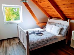 Postel nebo postele na pokoji v ubytování Čenovický dvůr