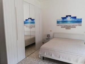 Ένα ή περισσότερα κρεβάτια σε δωμάτιο στο San Benedetto