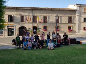 a group of people posing for a picture in front of a building at Domus Pacis Santa Chiara casa per ferie in Loreto