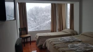 Postel nebo postele na pokoji v ubytování Monte Cervino Hotel