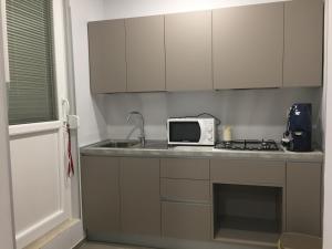 A kitchen or kitchenette at B&B San Francesco di Paola