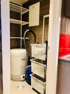 a bathroom with a toilet and a water hose at Morud in Meistervik +41 photos