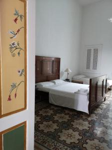 Säng eller sängar i ett rum på B&B Palazzo Antonelli