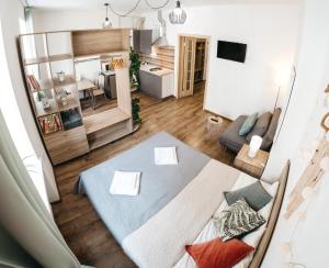 an overhead view of a living room and dining room at "Green Oasis Apartment" in Lviv