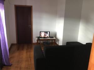 TV tai viihdekeskus majoituspaikassa A casa do Tí Mendonça