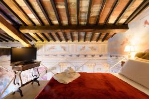 Posteľ alebo postele v izbe v ubytovaní Domus Nannini SPA - Palazzo Nannini