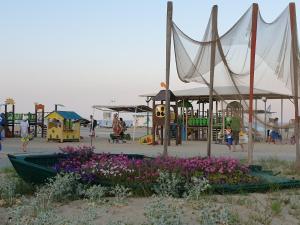 a playground with a park with a playground at Грибовка,Морской Аромат in Gribovka