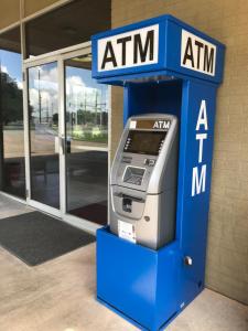 an atm machine in front of a building at Express Inn in Lafayette