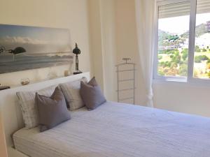 A bed or beds in a room at Valle Romano golf resort Capitolio Estepona