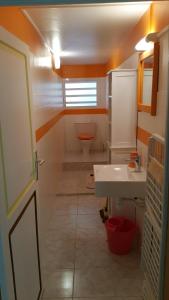 a bathroom with a sink and a toilet at TIKOLIBRI in Sainte-Anne